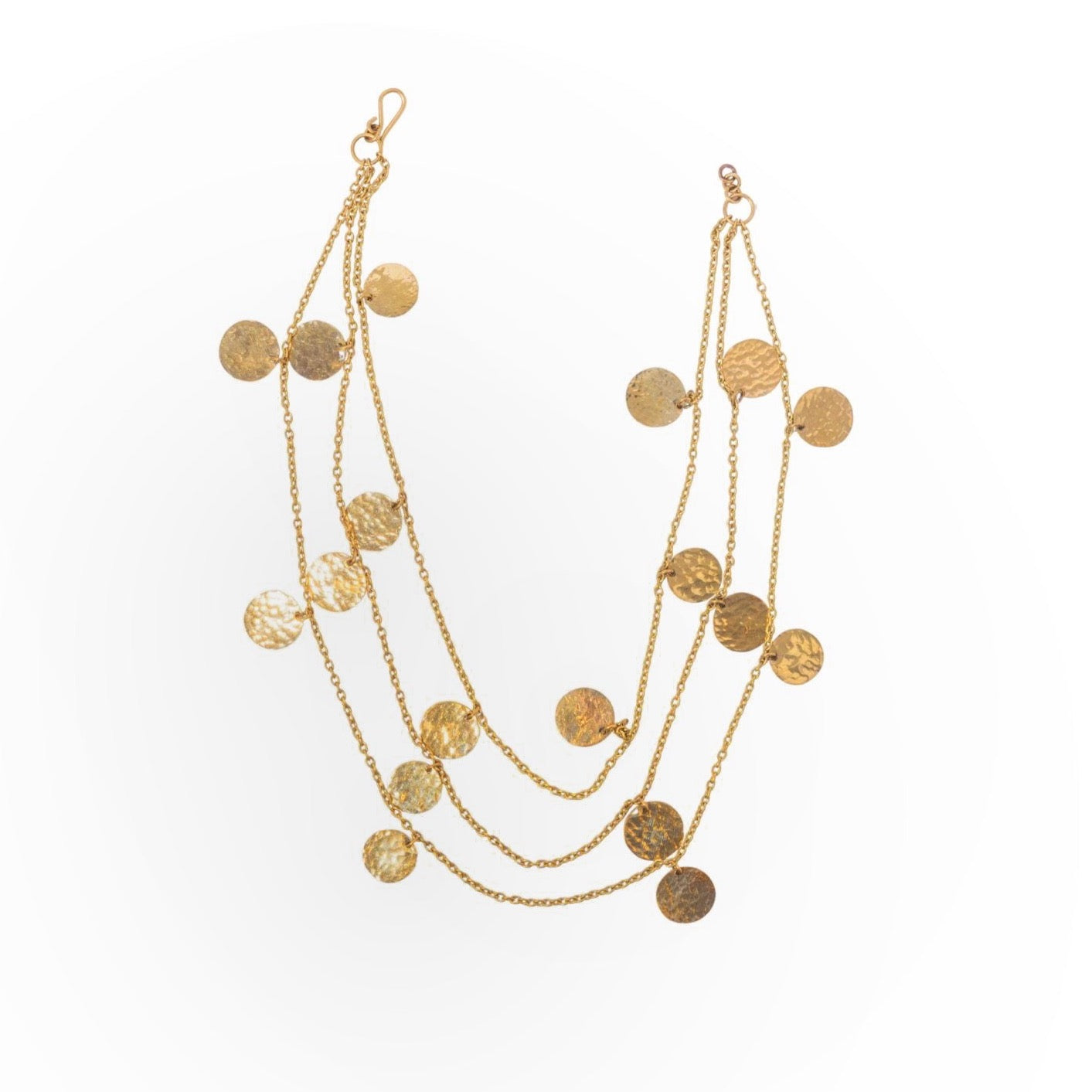 Multi-strand gold chandelier necklace with hammered disc pendants arranged in three cascading layers, displayed flat to highlight the delicate chain work and textured circular medallions