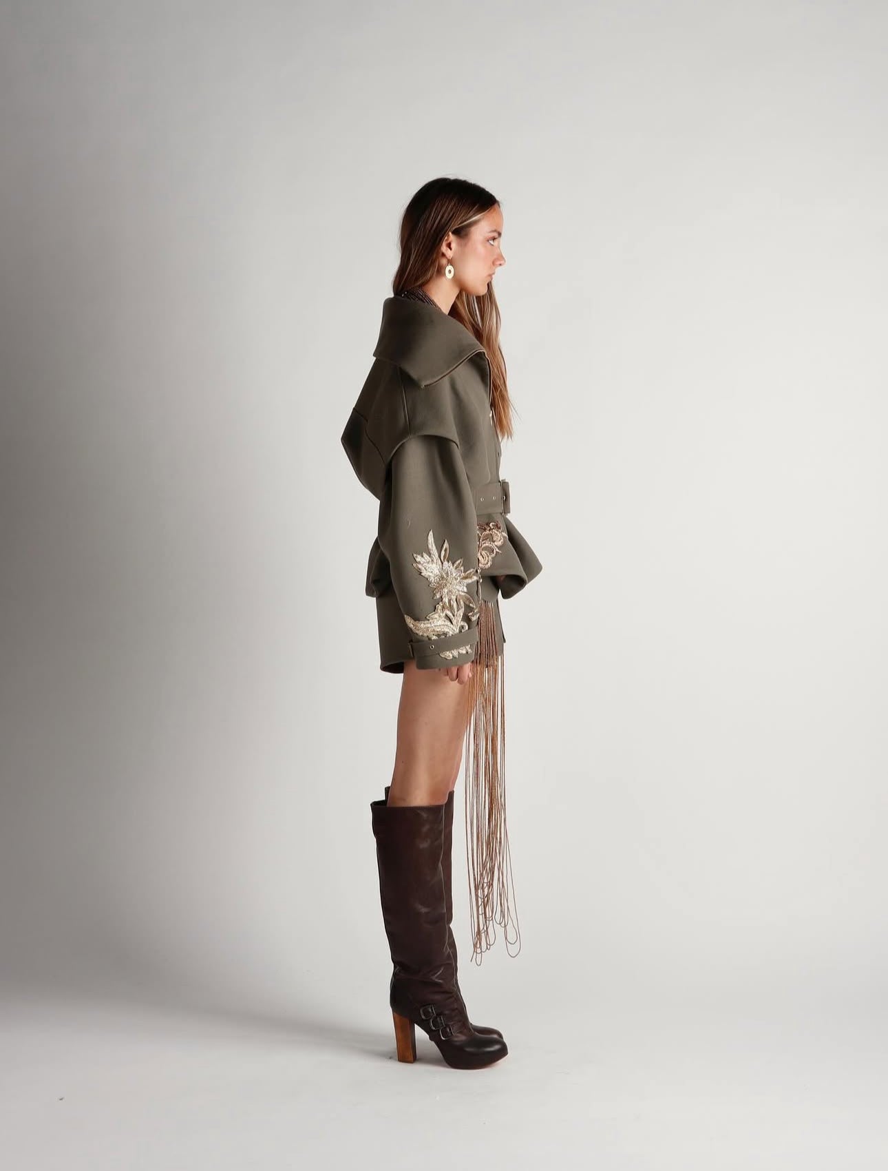 Woman wearing Eclipse earrings from Bambaz Kenyan artisan jewelry collection